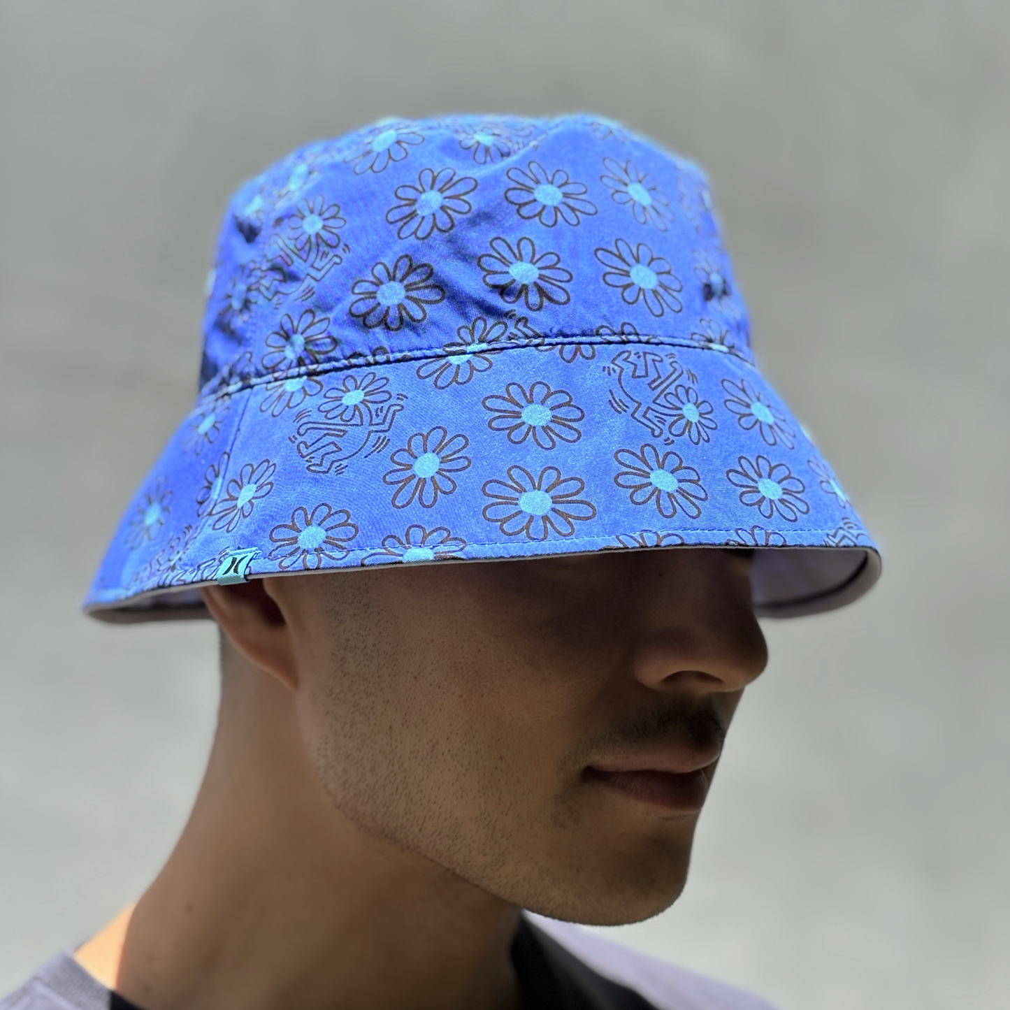 Hurley × Keith Haring Reversible Bucket Hat "Dancing Daisies"